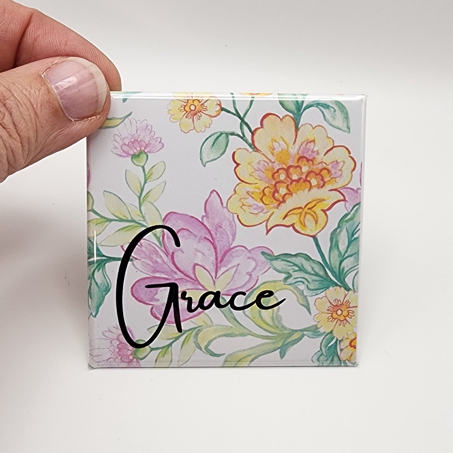 Floral background magnet with the word Grace 